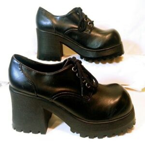 Image of 90s platformed black patent shoes.